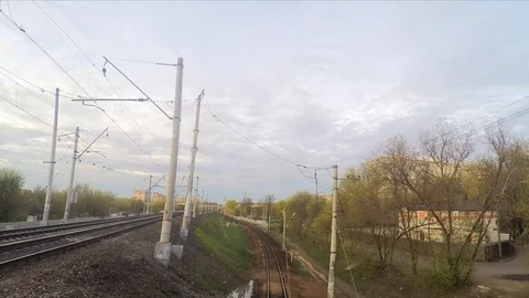 White clouds and trains on rails in spring timelapse 스톡 동영상 82988455
