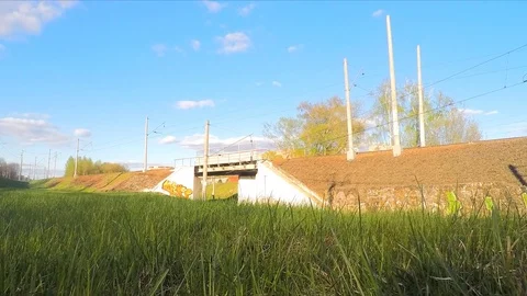 White clouds and trains in the spring timelapse Stock Footage 82980104