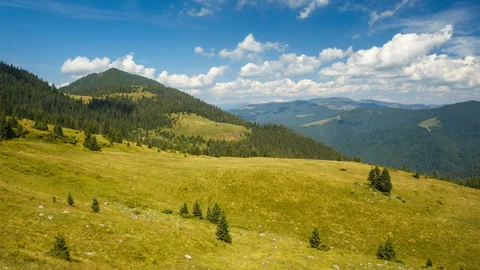 White clouds are flying over mountains in the sunny day at summer. Carpathians Stock Footage 132174021