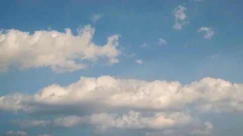 White clouds are moving slowly. time lapse. Stock Footage 145890008