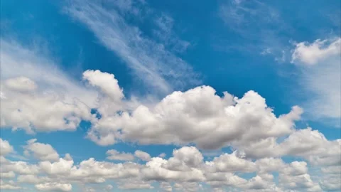 White clouds are passing under blue sky in relaxing time lapse clip Stock Footage 131273440