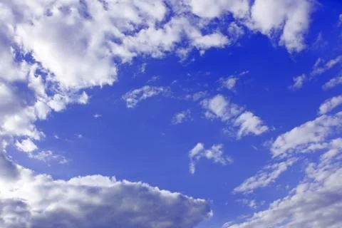 White clouds around blue sky Stock Photos