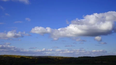 White clouds. autumn forest. time laps Stock Footage 97714873