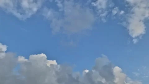 White clouds on a background of blue sky, timelaps Stock Footage 133537198