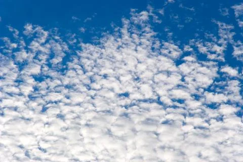 	White clouds on a background of the blue sky. Stock Photos