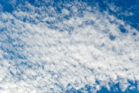 	White clouds on a background of the blue sky Stock Photos