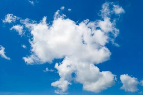 	White clouds on a background of the blue sky Stock Photos