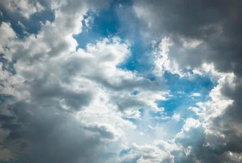 White clouds on a background of blue sky. Stock Photos