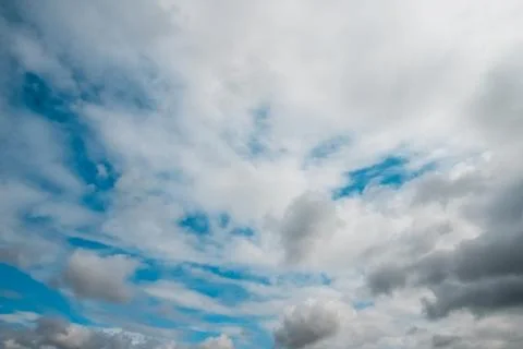 White clouds on background of blue sky on sunny day. Stock Photos