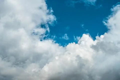 White clouds on background of blue sky on day. Stock Photos