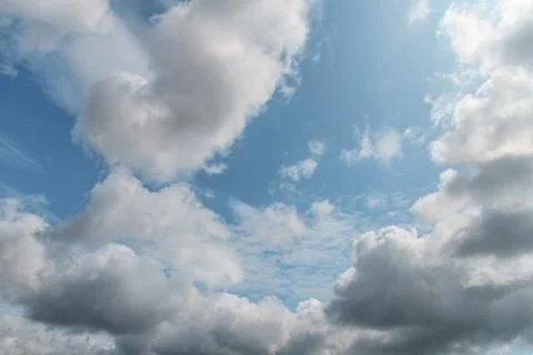 White clouds on background of blue sky on sunny day. Stock Photos