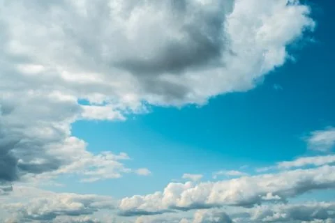 White clouds on background of blue sky on day. Stock Photos