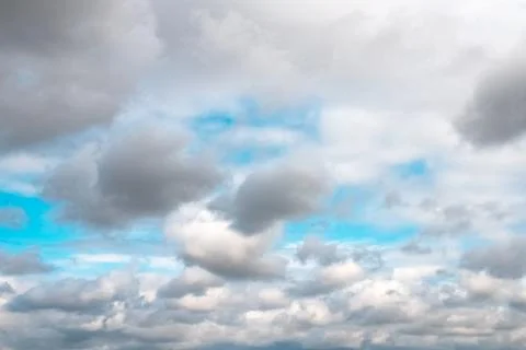 White clouds on background of blue sky on sunny day. Stock Photos