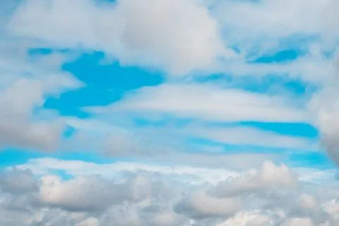 White clouds on background of blue sky on sunny day. Stock Photos