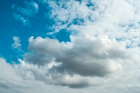 White clouds on background of blue sky on day. Stock Photos
