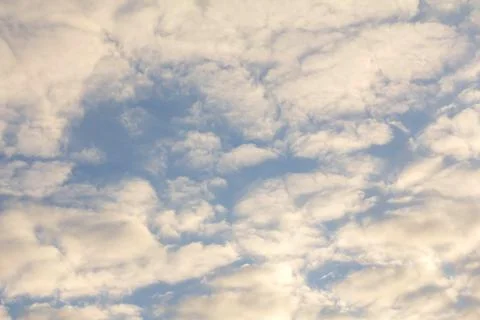 White clouds on the background of the blue sky Stock Photos