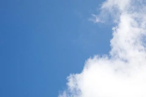 White clouds on the background of the blue sky Stock Photos
