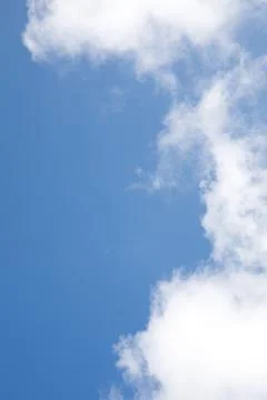 White clouds on the background of the blue sky Stock Photos