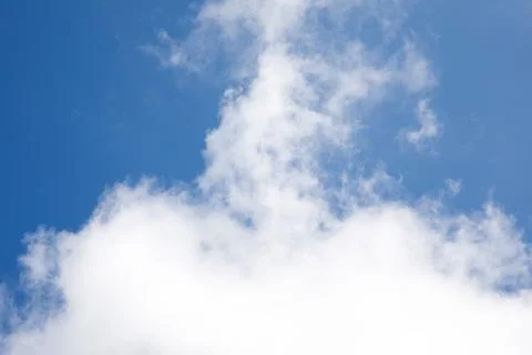 White clouds on the background of the blue sky Stock Photos