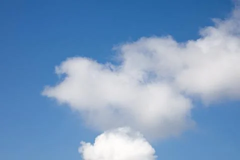 White clouds on the background of the blue sky Stock Photos
