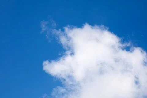 White clouds on the background of the blue sky Stock Photos