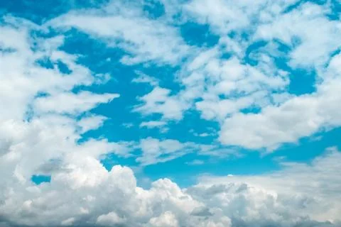 White clouds on background of sky on sunny day. Stock Photos
