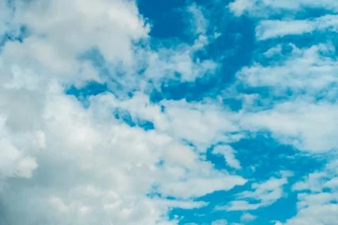 White clouds on background of sky on sunny day. Stock Photos