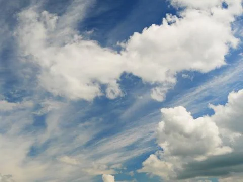 White clouds on a blue background Stock Photos