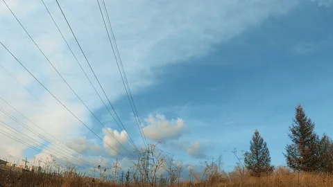 White clouds on a blue sky in autumn day, timelapse Stock Footage 119358441