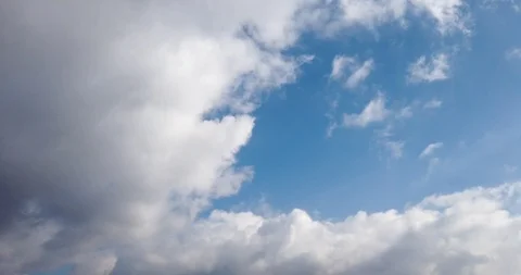 White clouds with blue sky background timelaps footage Stock Footage 125529421