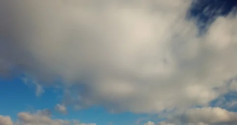 White clouds with blue sky background timelaps footage Stock Footage 125646517
