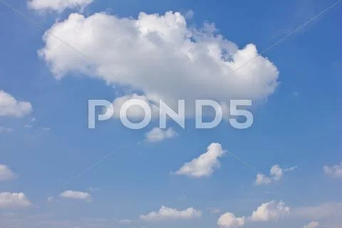 White clouds on a blue sky background Stock Photos