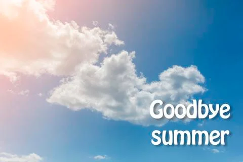 White clouds on the blue sky background. Goodbye summer. Toned. Foto stock