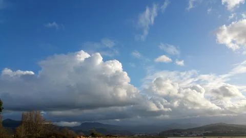 White clouds on the blue sky background Stock Photos