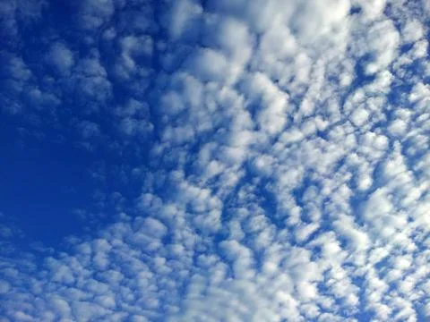 White clouds on the blue sky background Stock Photos