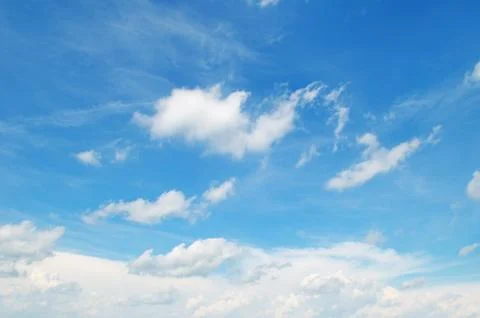 White clouds on a blue sky background Stock Photos