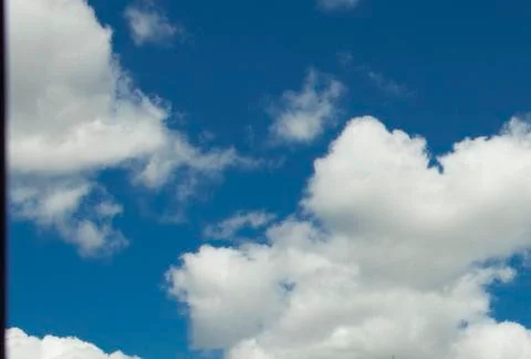 White clouds on blue sky background Stock Photos