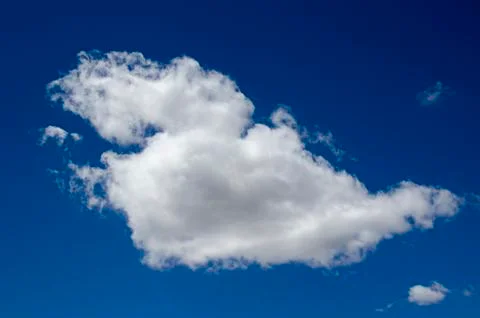 White clouds on a blue sky. Background. Stock Photos