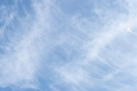 White clouds in the blue sky. Background Stock Photos