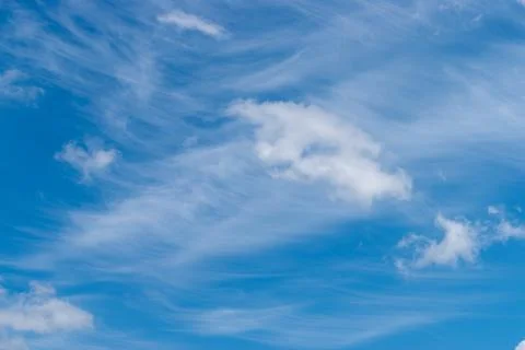 White clouds in the blue sky. Background Stock Photos