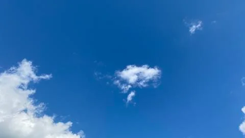 White clouds on a blue sky background Stock Photos