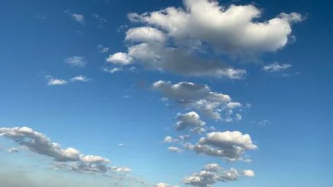 White clouds on a blue sky background Stock Photos
