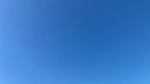 White clouds on a blue sky background Stock Photos