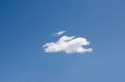 White clouds on a blue sky. Background. Stock Photos