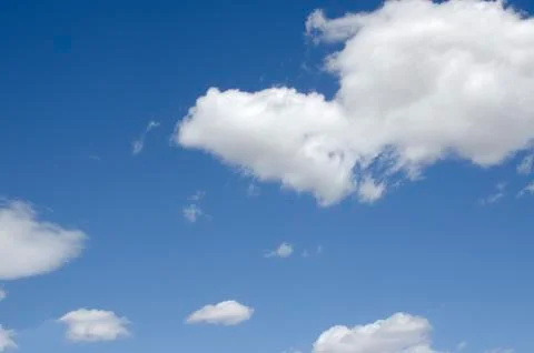 White clouds on a blue sky. Background. Stock Photos