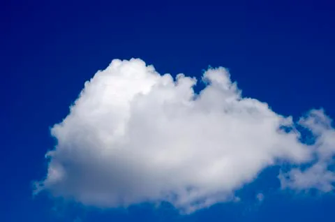 White clouds on a blue sky. Background. Stock Photos
