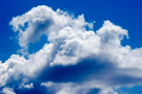 White clouds on a blue sky. Background. Stock Photos