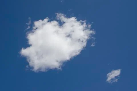 White clouds on a blue sky. Background. Stock Photos