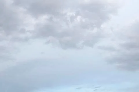 White clouds on a blue sky. Background. Stock Photos