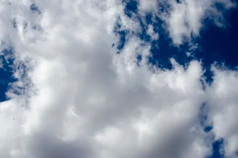 White clouds on a blue sky. Background. Stock Photos